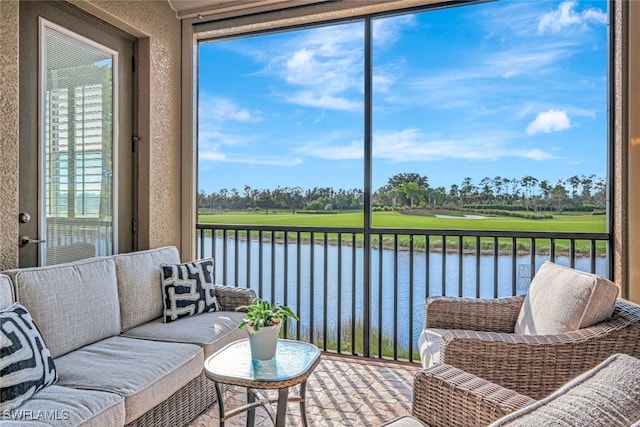 sunroom with a water view