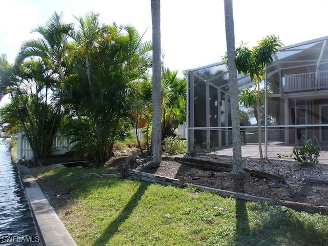 view of yard featuring glass enclosure