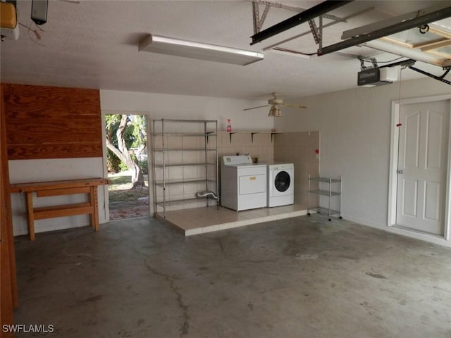 garage featuring ceiling fan, washer and clothes dryer, and a garage door opener