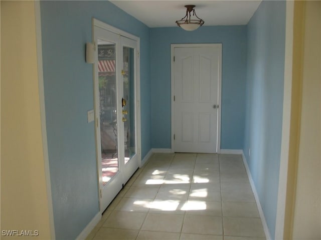 hallway featuring light tile patterned flooring