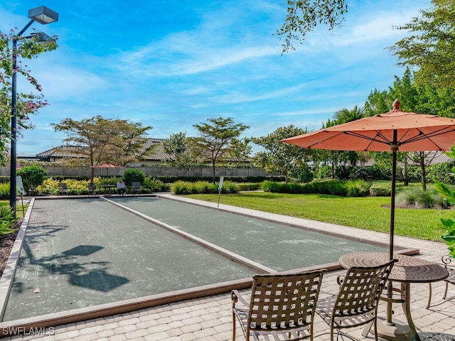 8524 Sevilla Ct, Naples, FL 34114 - surrounding community with a game area and a yard