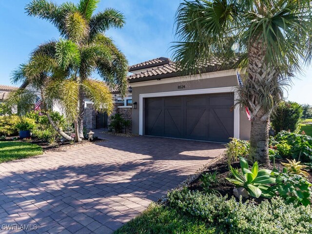 mediterranean / spanish-style home with a garage