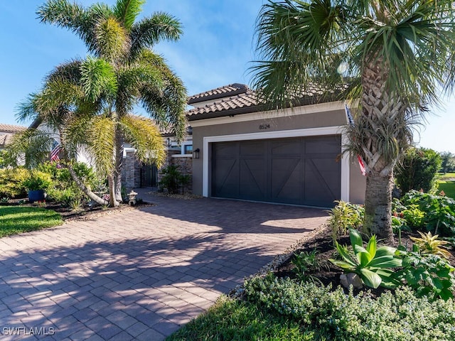 mediterranean / spanish-style home featuring a garage