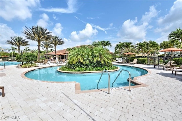 community pool with a patio