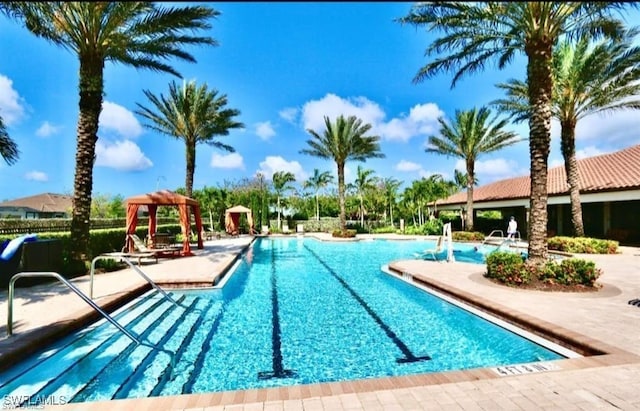 8524 Sevilla Ct, Naples, FL 34114 - community pool with a gazebo and a patio area