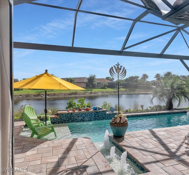 pool with glass enclosure, a water view, and a patio