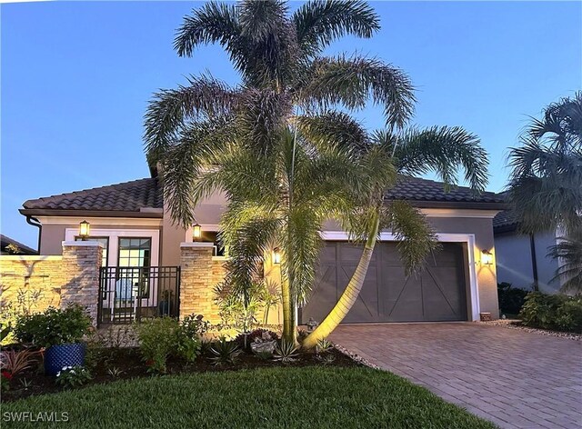 mediterranean / spanish-style house featuring a garage