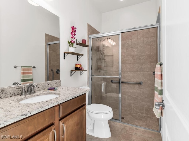8524 Sevilla Ct, Naples, FL 34114 - full bath featuring vanity, a stall shower, toilet, and tile patterned flooring