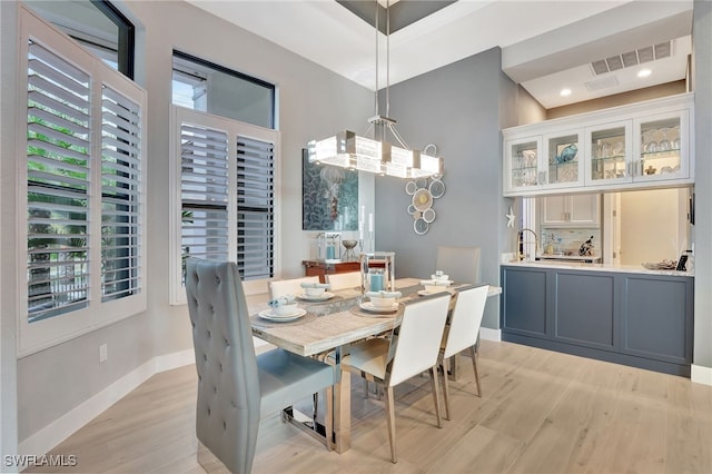 dining space featuring light wood-type flooring