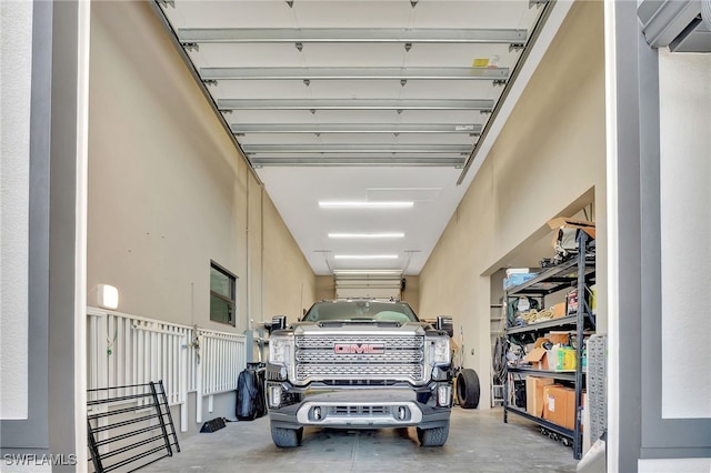 garage featuring an AC wall unit