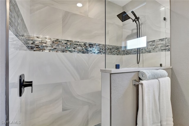 bathroom with a tile shower