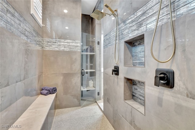 bathroom with tiled shower