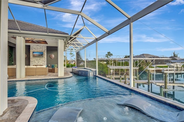 view of swimming pool featuring an outdoor living space, an in ground hot tub, a water view, and a lanai