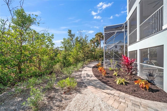 view of yard with a lanai