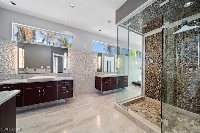 bathroom with vanity and a shower with shower door