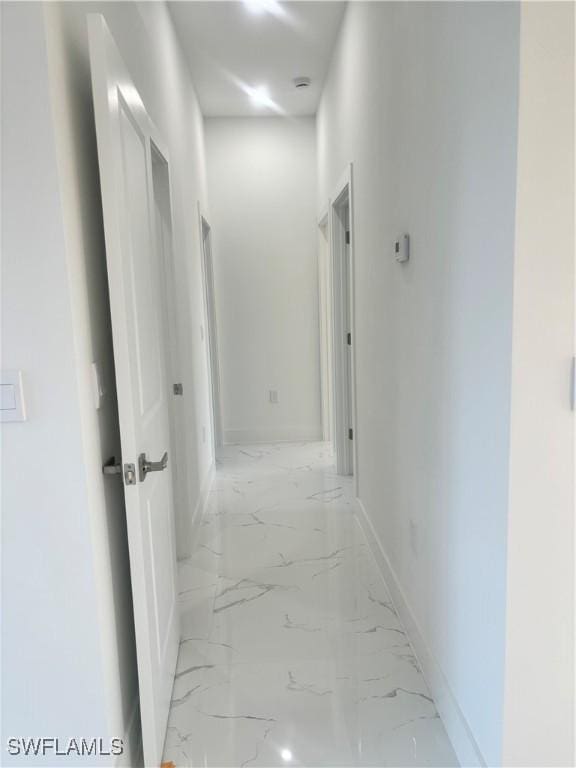 1115 Cumming St E, Lehigh Acres, FL 33974 - hall with light marble finish flooring