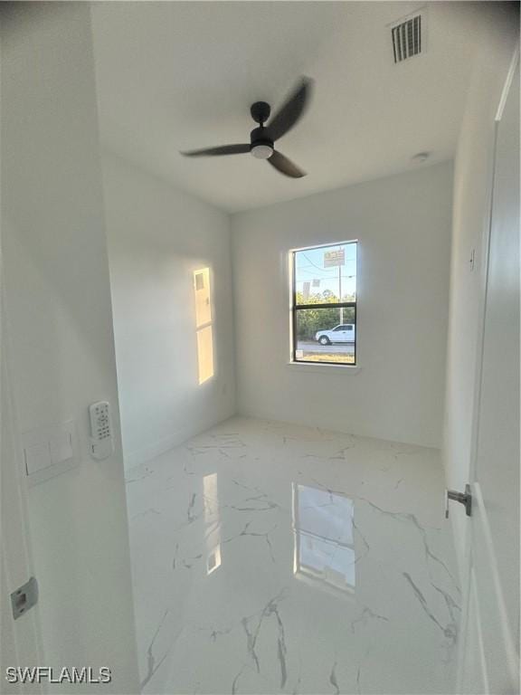 spare room featuring ceiling fan