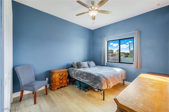 bedroom featuring hardwood / wood-style flooring and ceiling fan