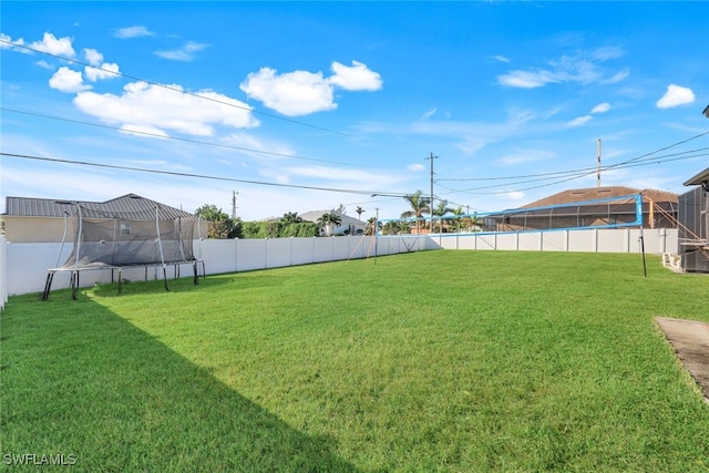 view of yard with a trampoline