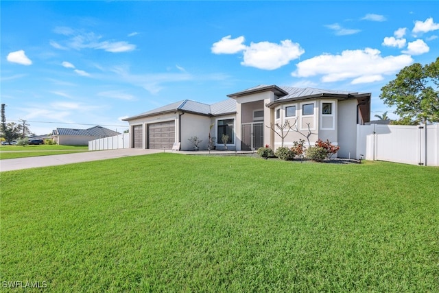 view of front facade featuring a garage and a front lawn