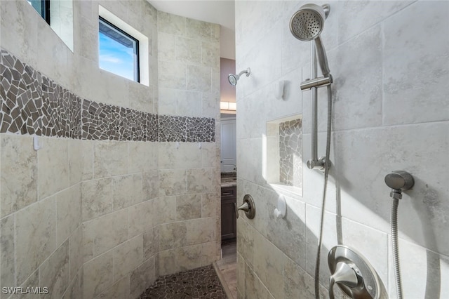 bathroom with a tile shower