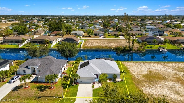 drone / aerial view with a water view