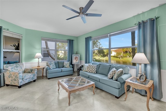 living room with plenty of natural light and ceiling fan