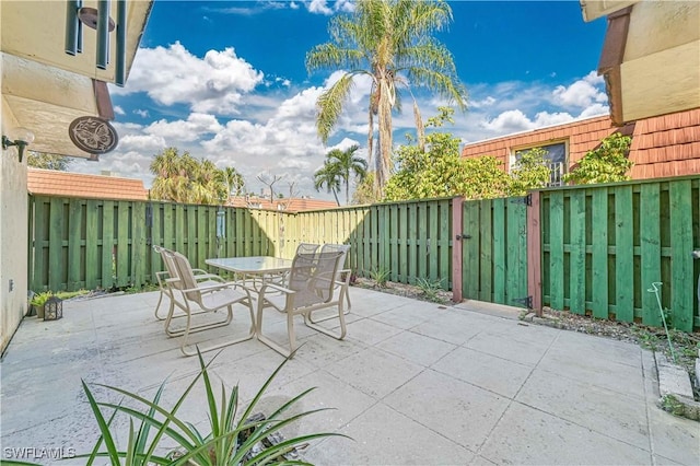 view of patio / terrace featuring outdoor dining space and a fenced backyard
