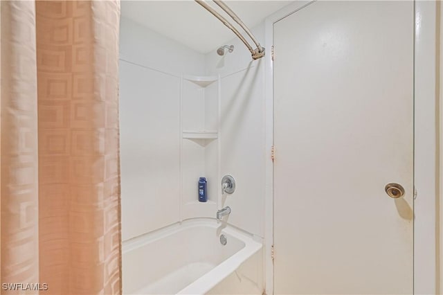 bathroom with shower / tub combo with curtain