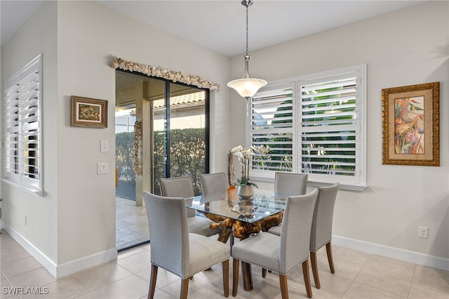 dining room with plenty of natural light and light tile patterned flooring