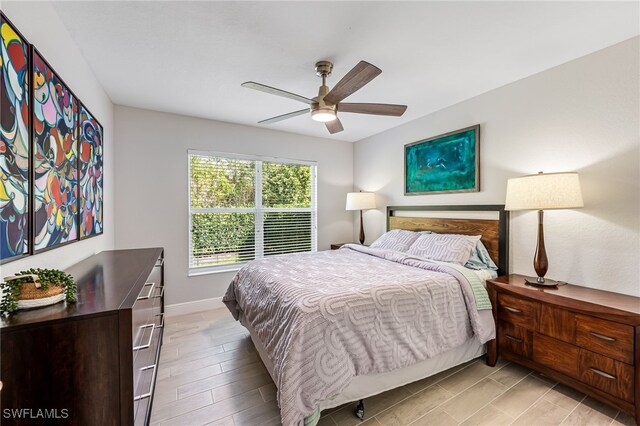 bedroom featuring ceiling fan and light hardwood / wood-style floors