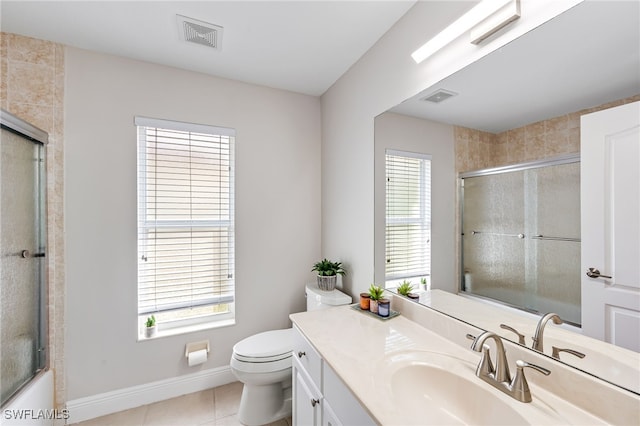 full bathroom with tile patterned flooring, vanity, toilet, and a healthy amount of sunlight