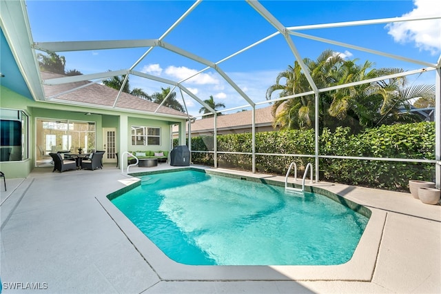 view of swimming pool featuring a lanai, a patio area, and an outdoor hangout area