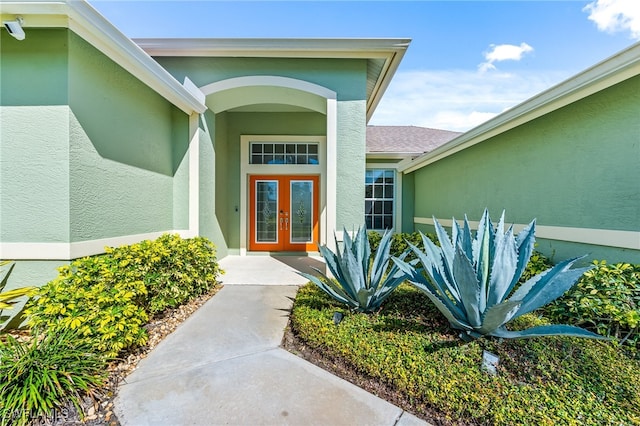 view of exterior entry featuring french doors