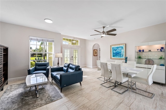 dining area with french doors and ceiling fan