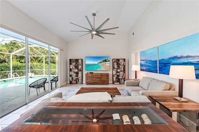 living room featuring light tile patterned floors, vaulted ceiling, and ceiling fan