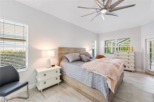 bedroom featuring access to outside, light hardwood / wood-style flooring, and ceiling fan