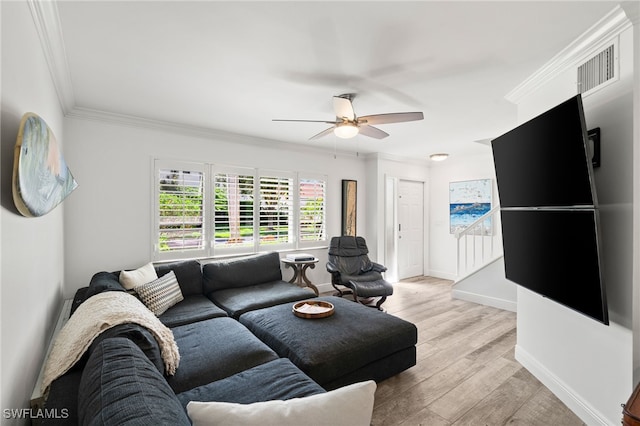 living room featuring ceiling fan, light hardwood / wood-style floors, and ornamental molding