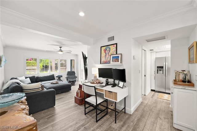 living room featuring ceiling fan, light wood-type flooring, and ornamental molding