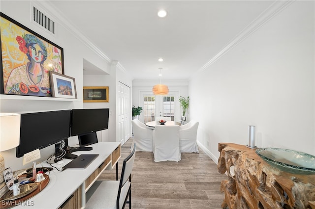 office area featuring light hardwood / wood-style floors, crown molding, and french doors