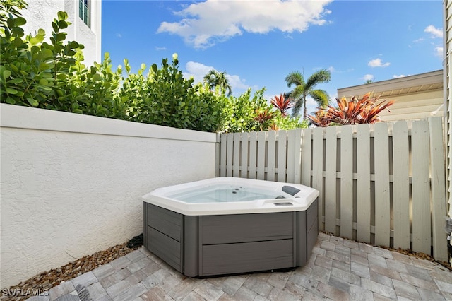 view of patio / terrace featuring a hot tub