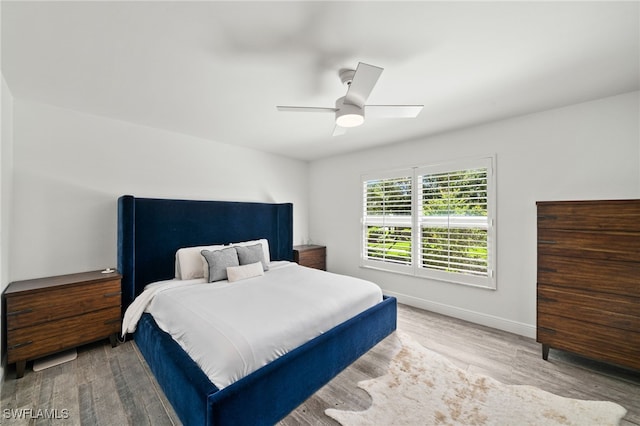 bedroom featuring ceiling fan and light hardwood / wood-style floors