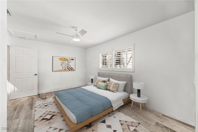 bedroom featuring ceiling fan and light hardwood / wood-style floors