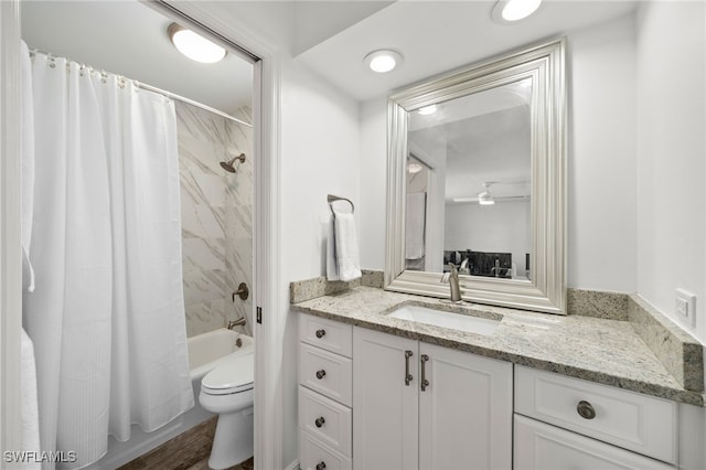 full bathroom featuring shower / tub combo, vanity, toilet, and wood-type flooring