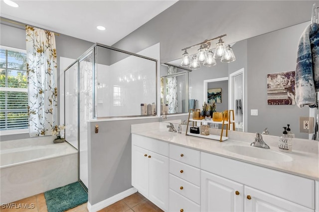 bathroom with tile patterned flooring, vanity, and plus walk in shower