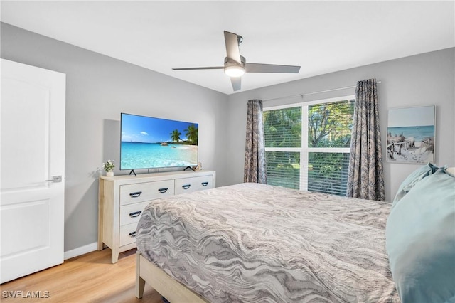 bedroom featuring light hardwood / wood-style flooring and ceiling fan