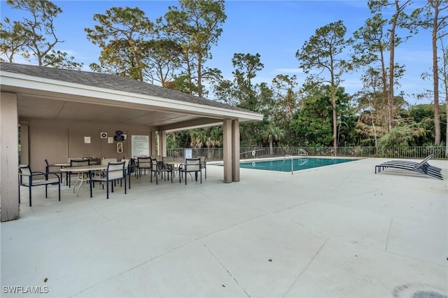 view of swimming pool with a patio area