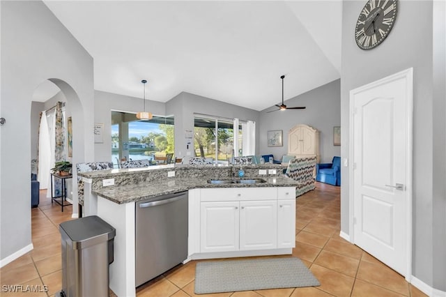 kitchen with pendant lighting, dishwasher, white cabinets, and dark stone counters