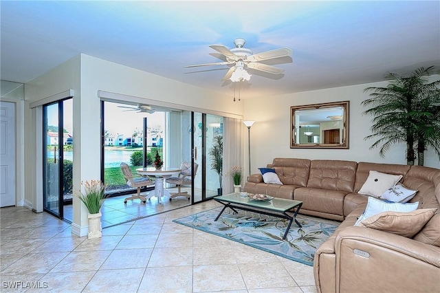 living area featuring light tile patterned floors and a ceiling fan