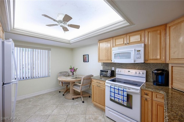 kitchen with backsplash, baseboards, ceiling fan, light tile patterned floors, and white appliances